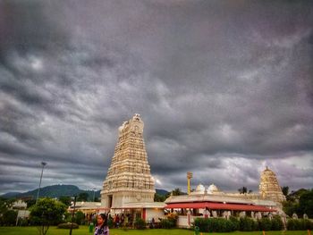 Temple against buildings in city