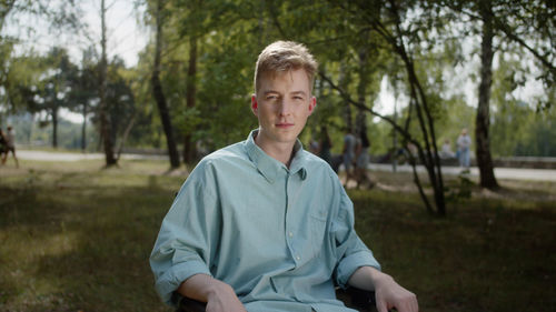 Portrait of young man standing outdoors