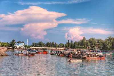 Boats in sea against sky