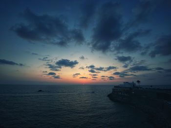 Scenic view of sea against sky at sunset