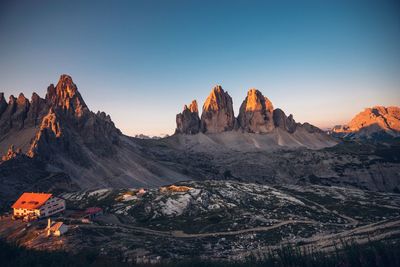 Panoramic view of landscape with mountain range at sunset