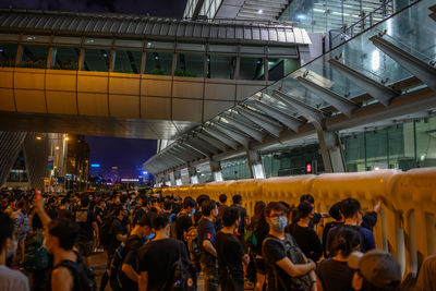 Group of people waiting for sale in city