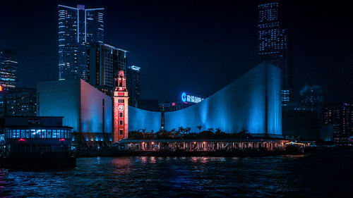 Illuminated city at waterfront