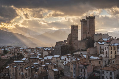 Cityscape against sky during sunset