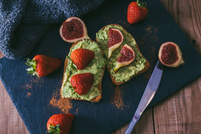 Avocado or guacamole toast with berries