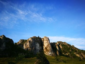 Rock formations against blue sky