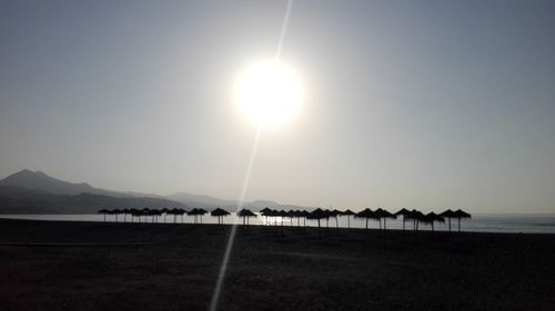 Scenic view of beach against sky during sunset