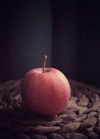 Close-up of apple against black background