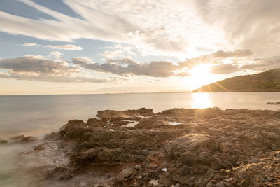 Scenic view of sea against sky during sunset