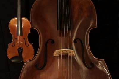 Close-up of violin against black background