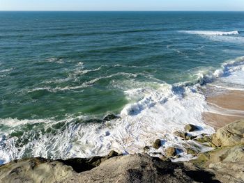 Scenic view of sea against clear sky