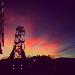 Silhouette of cranes at sunset