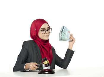 Mid adult man wearing mask against white background