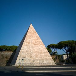 View of historical pyramid against blue sky