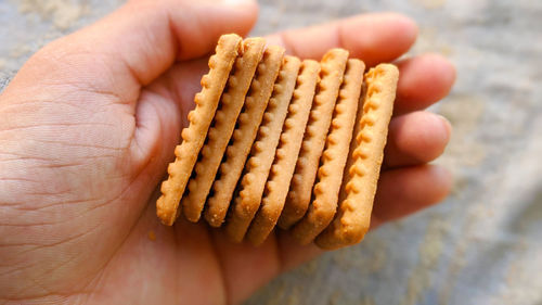 Close-up of hand holding bread