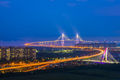 Light trails on suspension bridge at night