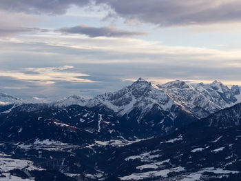 Scenic view of snowcapped mountains against sky