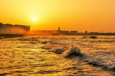 Scenic view of sea against sky during sunset