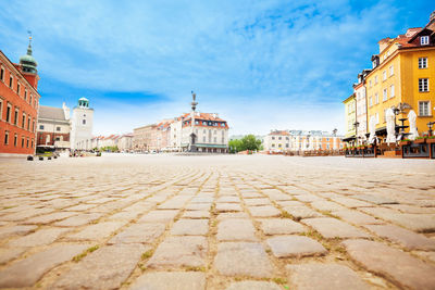 View of buildings in town against sky