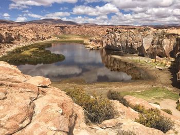 Scenic view of rock formations against sky