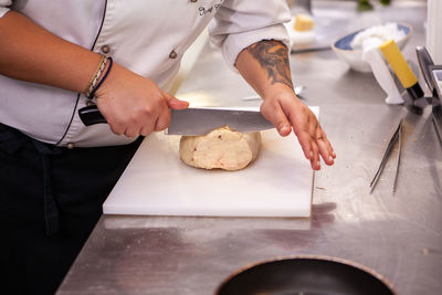 Midsection of man preparing food