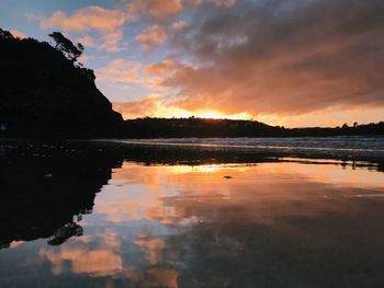Scenic view of lake against sky during sunset