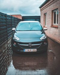 Car on street against buildings