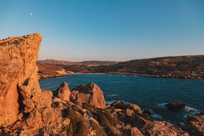 Scenic view of sea against clear blue sky