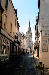 Empty alley along buildings