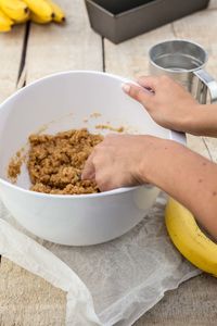 Cropped image of women preparing cake at table