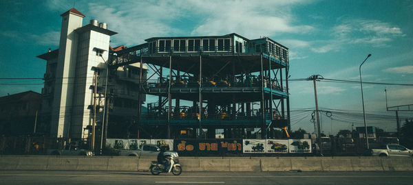 Ferris wheel in city against sky