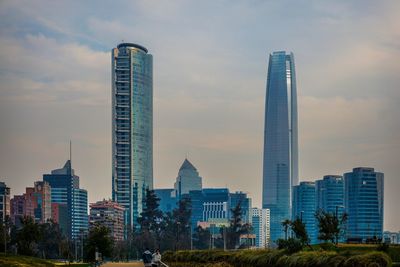 Skyscrapers in city against sky