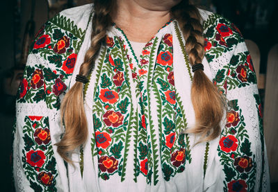 Midsection of woman with braided hair