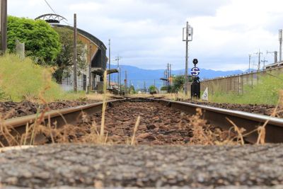 Train on railroad track against sky