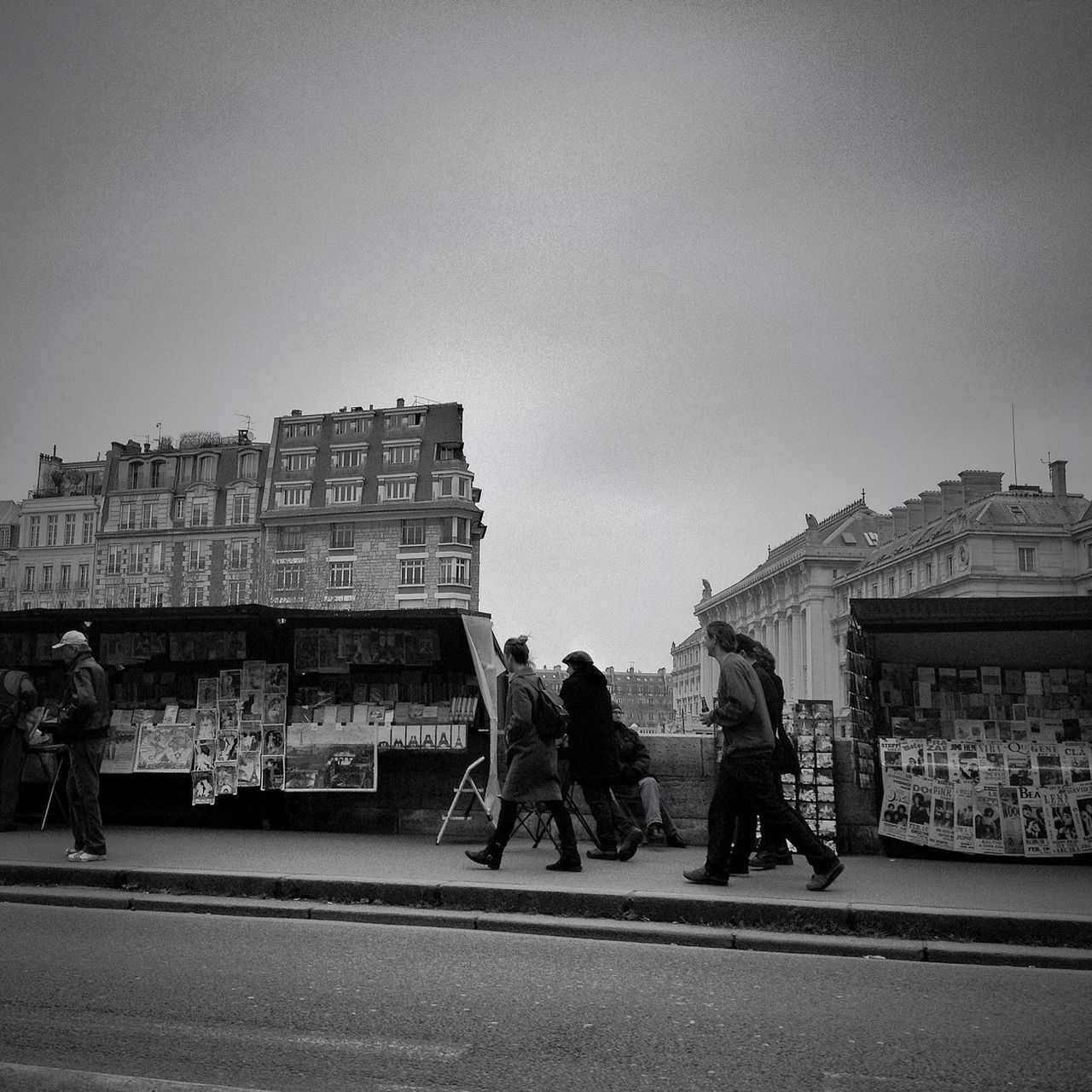 building exterior, architecture, built structure, men, lifestyles, street, city, full length, walking, person, leisure activity, sky, city life, transportation, rear view, road, casual clothing