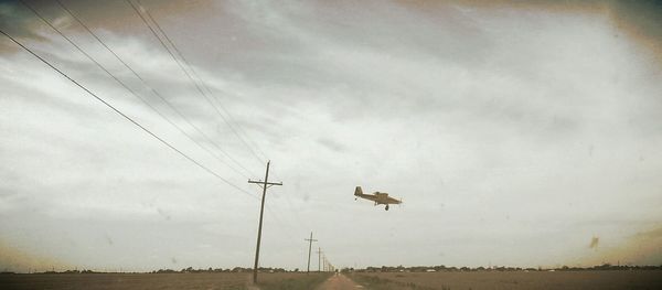 View of road against cloudy sky