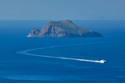 Speeding speed boat catamaran ship in aegean sea near milos island in greece