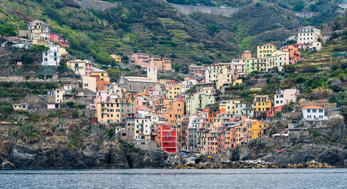 Buildings in town by sea