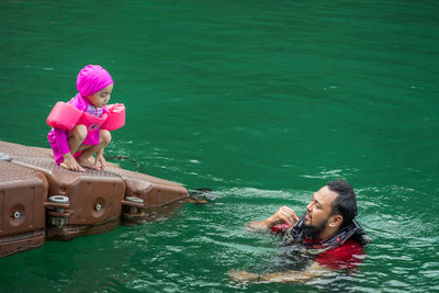 High angle view of woman swimming in water