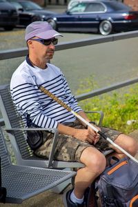 Man sitting on seat in train