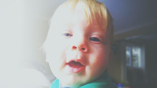 Close-up portrait of cute baby at home