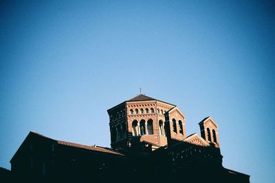 Low angle view of built structure against clear blue sky