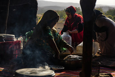 Group of people at market stall