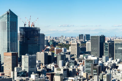 Modern buildings in city against sky