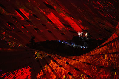 High angle view of man swimming in pool at night