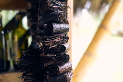 Close-up of tied up on wood