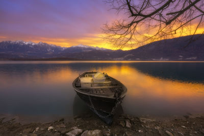 Scenic view of lake against sky during sunset