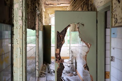 Broken door in abandoned house