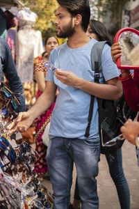 Man looking sunglasses in market