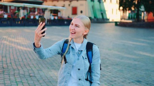 Young woman using mobile phone